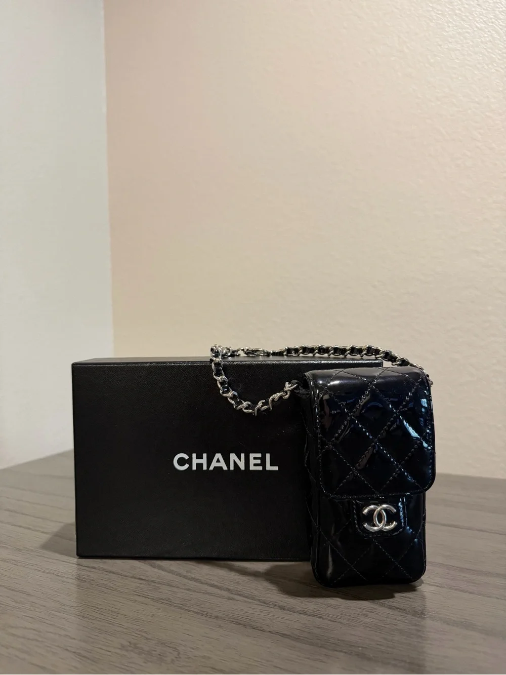 CHANEL Black Patent Leather Quilted Phone Case with Silver Hardware